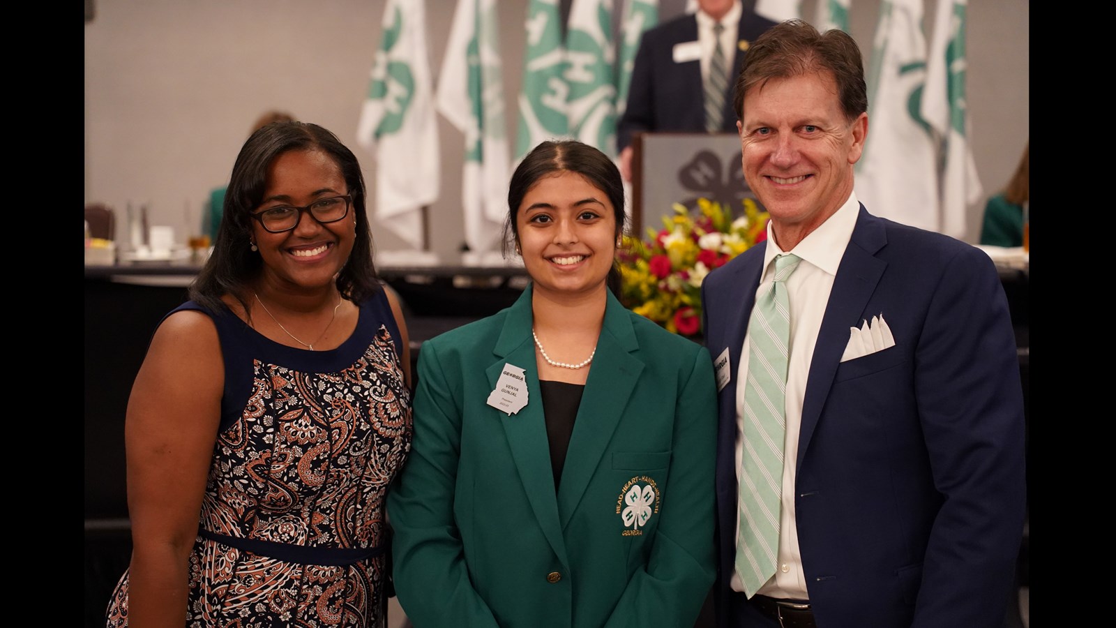 Wheeler High School Student Venya Gunjal Ms. Brittani Lee, Cobb County Extension Agent, and Mr. Scott Shell, Chairman of the Georgia 4-H Foundation Board of Trustees, after being inducted into the presidency at 2022 State 4-H Congress.